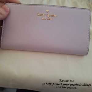kate spade lilac zip-around saffiano wallet with gold logo